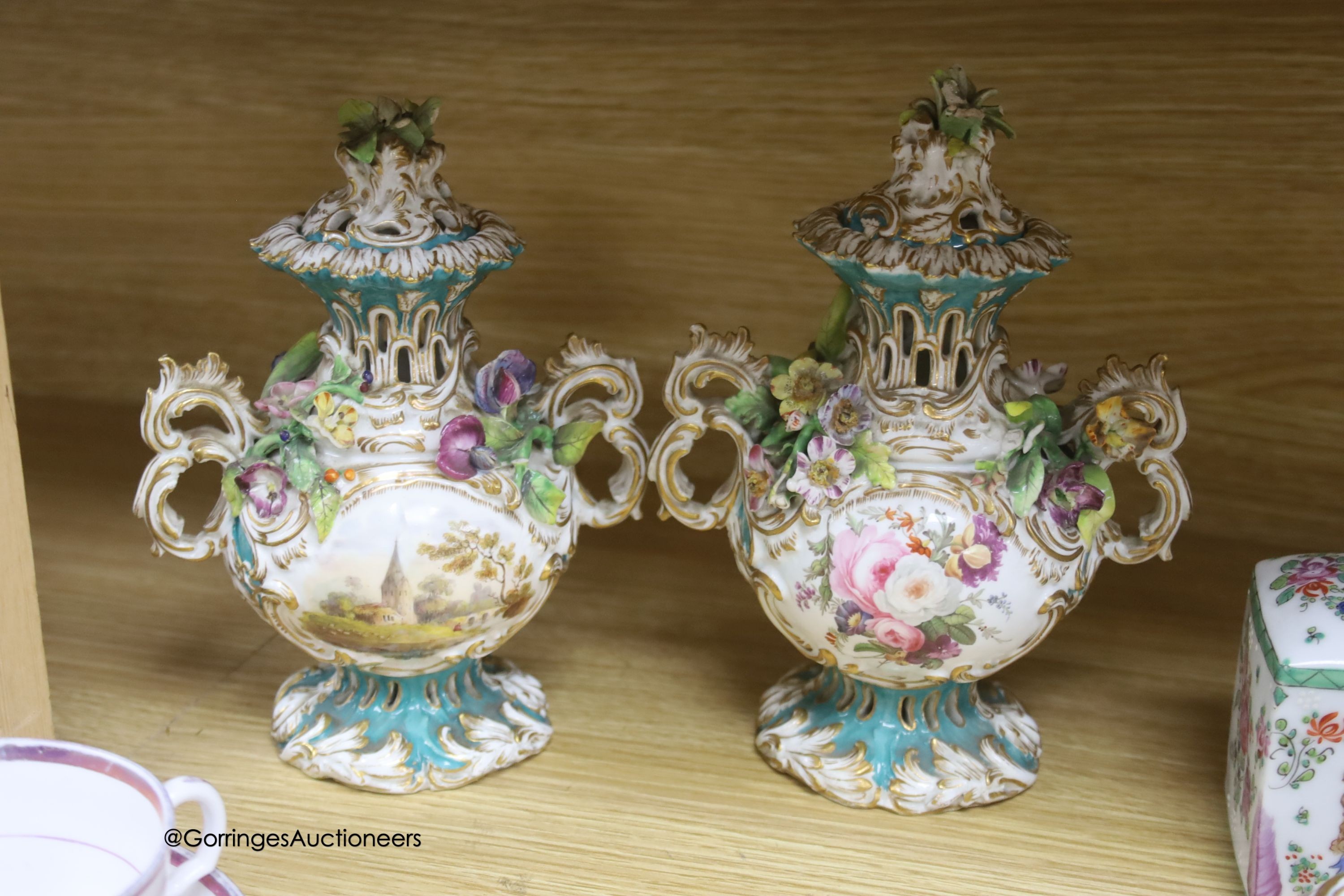 A pair of Rockingham style floral encrusted lidded vases, an armorial jar, two 19th-century English porcelain dishes etc